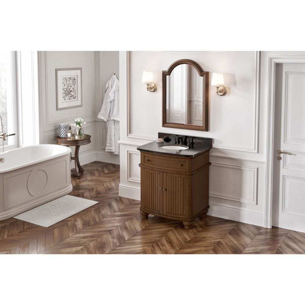 Simple beadboard doors, curved bun feet, and a rounded front form this cottage-style vanity collection. An adjustable shelf is positioned in the cabinet for optimal storage.