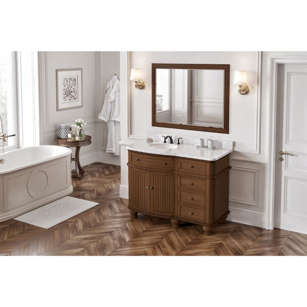 Simple beadboard doors, curved bun feet, and a rounded front form this cottage-style vanity collection.