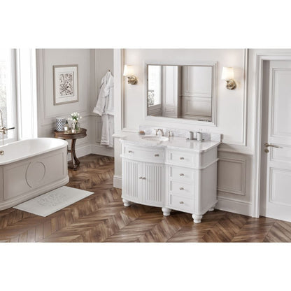 Simple beadboard doors, curved bun feet, and a rounded front form this cottage-style vanity collection.