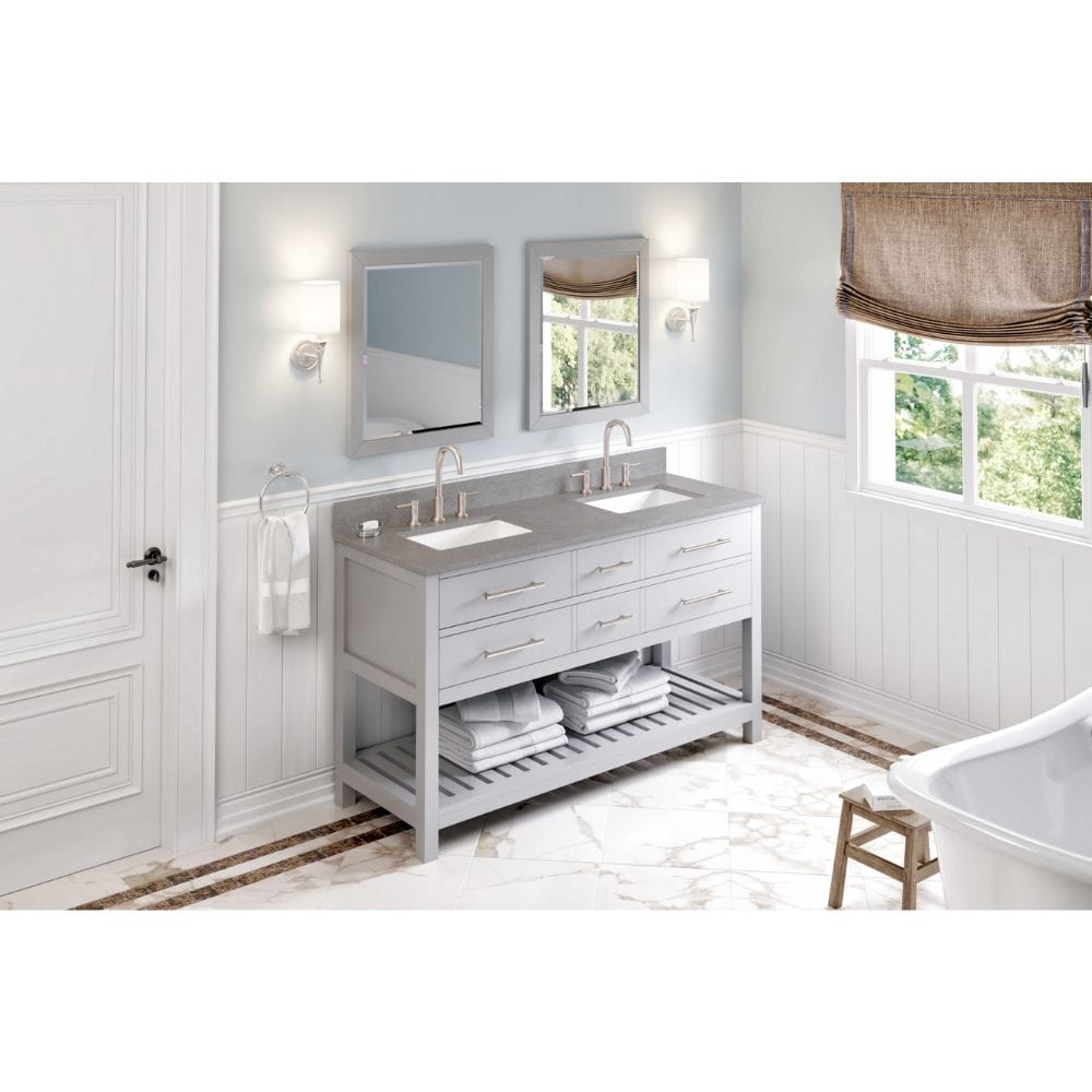 Escape to the seaside with the Wavecrest vanity. Crisp, clean edges and a slatted bottom shelf evoke a coastal calm feeling. False front drawers are transformed into hidden tipout storage space with solid hardwood custom sized tipout trays. 